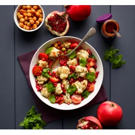Warm Spiced Cauliflower and chickpea salad, with pomegranate seeds